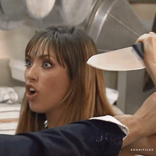 A Woman Is Holding A Knife Over Her Head And The Word Anahifiles Is On The Bottom GIF