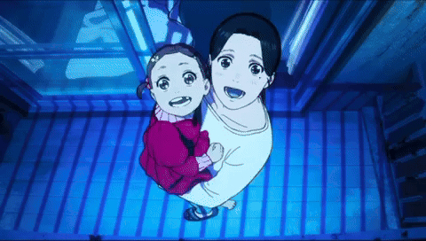 A Woman Is Holding A Little Girl In Her Arms While Looking Up GIF