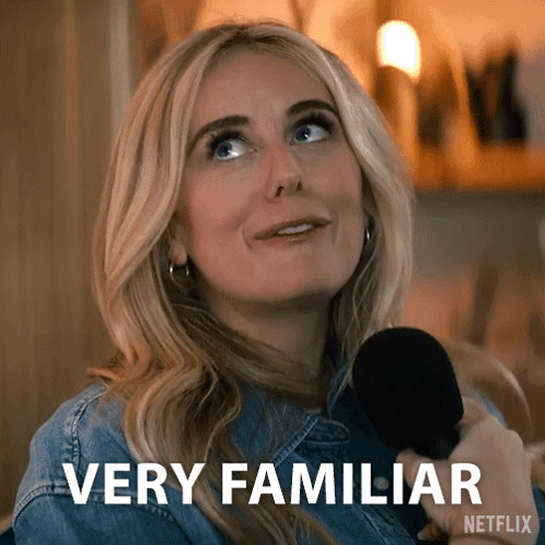 A Woman Is Holding A Microphone And Says Very Familiar On The Screen GIF