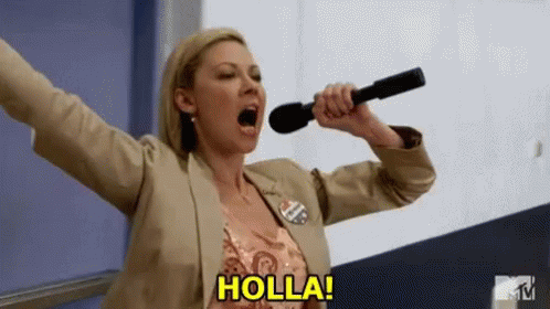 A Woman Is Holding A Microphone With Her Mouth Open And Screaming . GIF