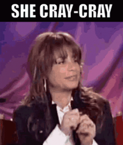 A Woman Is Holding A Microphone With The Words She Cray-Cray Above Her GIF