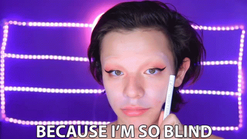 A Woman Is Holding A Pencil In Front Of Her Face With The Words Because I 'M So Blind Below Her GIF