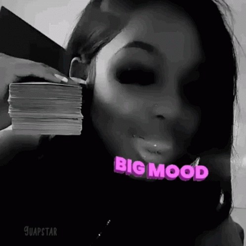 Woman Holding Pile Of Money In Front Of Face GIF