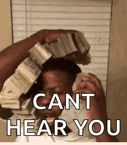 A Woman Is Holding A Pile Of Money Over Her Head And Says Cant Hear You GIF