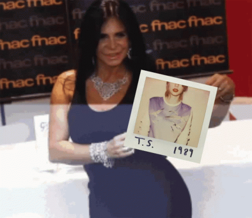 Woman Holding Polaroid Of T.S. 1989 GIF