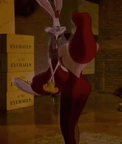 A Woman Is Holding A Rabbit In Front Of A Stack Of Eyeballs Boxes GIF