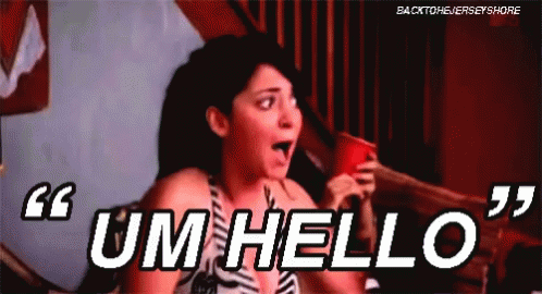 A Woman Is Holding A Red Cup And Saying Um Hello . GIF