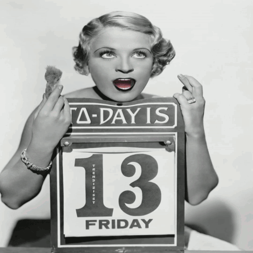 A Woman Is Holding A Sign That Says A-Day Is 13 Friday GIF