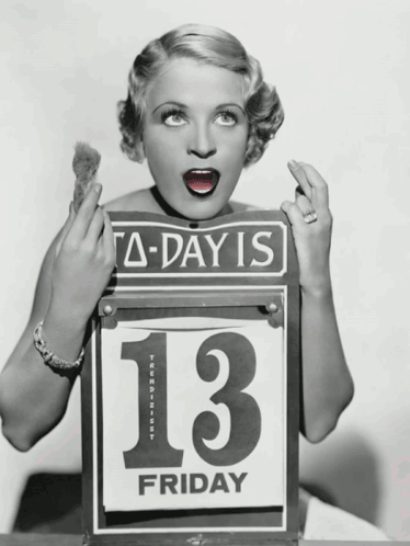 A Woman Is Holding A Sign That Says Today Is 13 Friday GIF