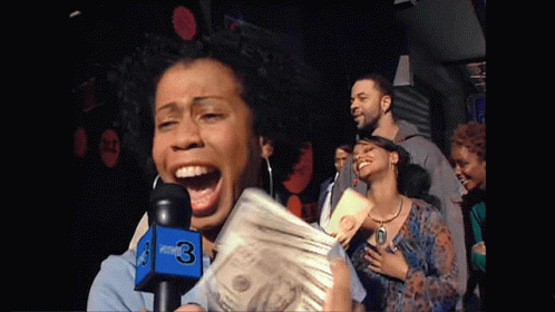A Woman Is Holding A Stack Of Money In Front Of A Microphone That Says News 3 GIF