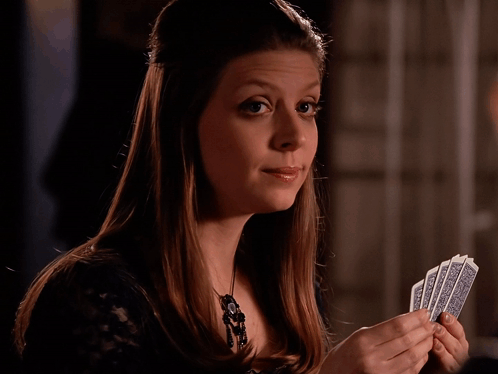 Woman Holding Cards With A And R GIF