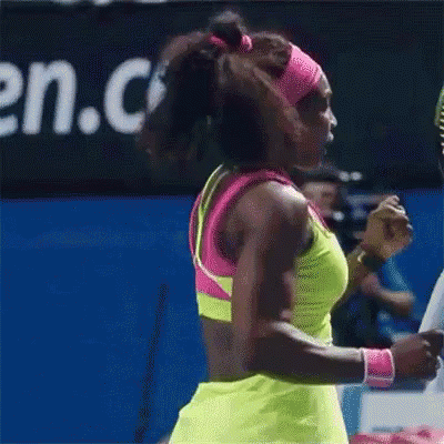 A Woman Is Holding A Tennis Racquet With A Wilson Logo On It GIF