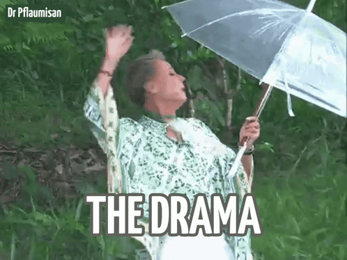 A Woman Is Holding An Umbrella In The Rain And The Word The Drama Is On The Bottom Right GIF