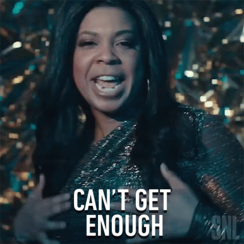 A Woman Is Holding Her Chest And Says Can 'T Get Enough GIF