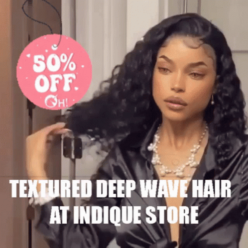 A Woman Is Holding Her Hair In Front Of A Sign That Says 50 % Off At Indicque Store GIF