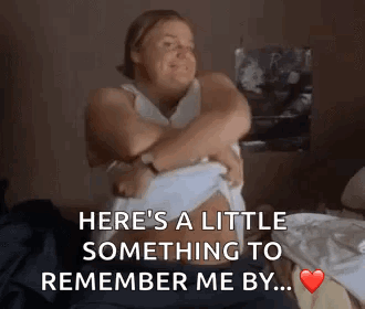 A Woman Is Hugging Her Stomach With The Words Here 'S A Little Something To Remember Me By .. On The Bottom GIF