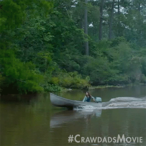 A Woman Is In A Boat On A River With The #Crawdadsmovie Written On The Bottom GIF