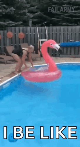 A Woman Is Jumping Into A Pool With An Inflatable Flamingo . GIF