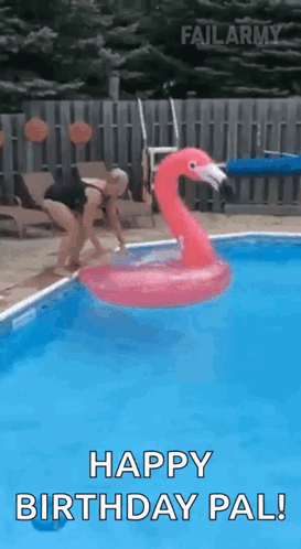 A Woman Is Jumping Into A Swimming Pool With A Flamingo Float . GIF