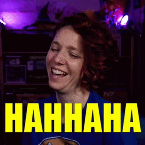 A Woman Is Laughing In Front Of A Sign That Says Nahhaha GIF