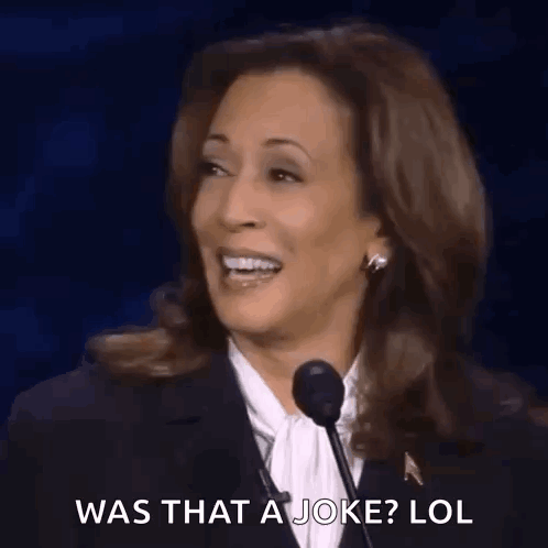 A Woman Is Laughing While Talking Into A Microphone . GIF