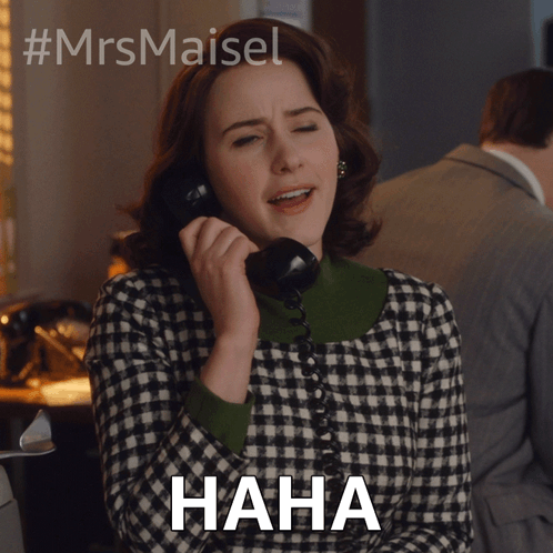 A Woman Is Laughing While Talking On A Phone And The Word Haha Is Below Her GIF