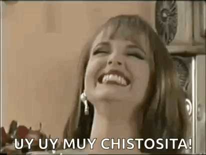 A Woman Is Laughing With Her Mouth Open And The Words Uy Uy Muy Chistosita . GIF