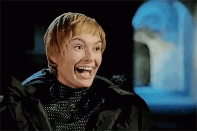 A Woman Is Laughing With Her Mouth Open And Wearing A Black Jacket . GIF