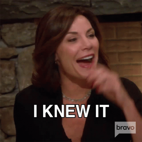 A Woman Is Laughing With The Words I Knew It Above Her GIF
