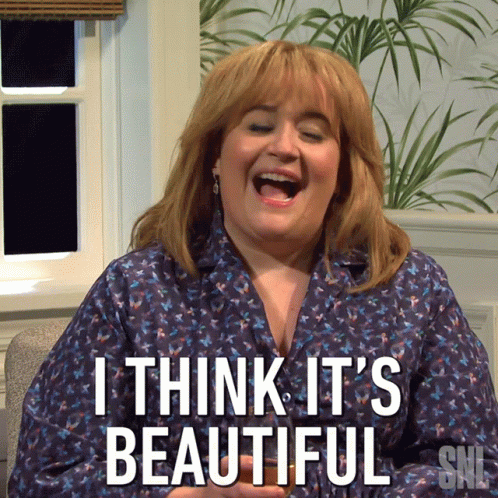 A Woman Is Laughing With The Words I Think It 'S Beautiful On Her Shirt GIF