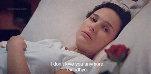 A Woman Is Laying In A Hospital Bed With A Rose And Says " I Don 'T Love You Anymore " GIF