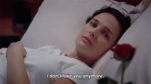 A Woman Is Laying In A Hospital Bed With A Rose And Says I Don T Love You Anymore . GIF