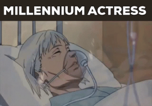 A Woman Is Laying In A Hospital Bed With An Oxygen Mask On Her Face And The Words " Millennium Actress " Above Her GIF