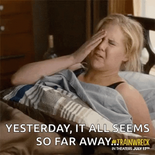 A Woman Is Laying In Bed With Her Hand On Her Forehead And A Caption That Says Yesterday It All Seems So Far Away GIF