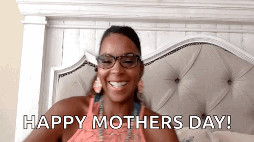 a woman is laying in bed with the words happy mothers day