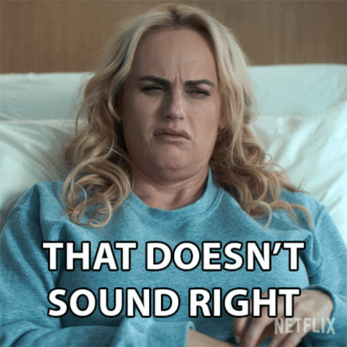 A Woman Is Laying In Bed With The Words That Does N't Sound Right On Her Shirt GIF