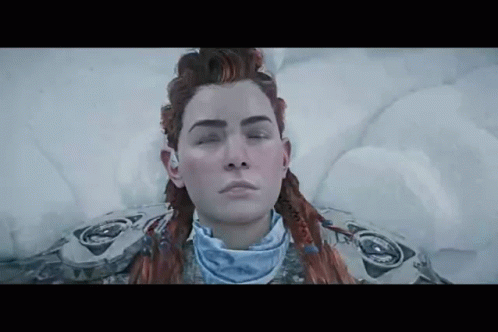 A Woman Is Laying In The Snow With Her Eyes Closed And Her Hair In A Braid . GIF