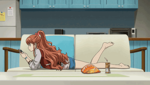 A Woman Is Laying On A Couch With A Bag Of Chips And A Drink GIF