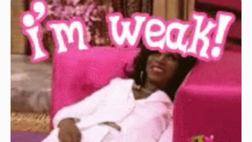 A Woman Is Laying On A Pink Couch With A Sign That Says `` I 'M Weak '' On Her Head . GIF
