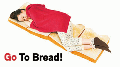 A Woman Is Laying On A Slice Of Bread With The Words Go To Bread Behind Her GIF