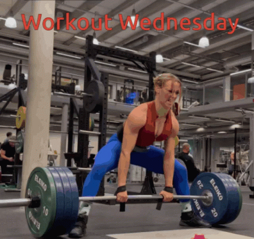 A Woman Is Lifting A Barbell In A Gym And The Words Workout Wednesday Are On The Bottom GIF