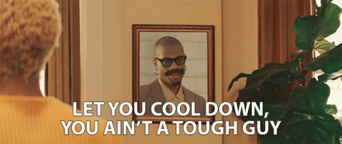 A Woman Is Looking At A Picture Of A Man With Glasses And A Mustache And Says Let You Cool GIF