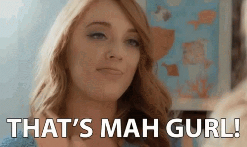 A Woman Is Looking At Herself In The Mirror And Saying `` That 'S Mah Gurl ! '' GIF