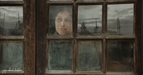 A Woman Is Looking Out Of A Window With The Words " Life About Little " Written On The Bottom GIF