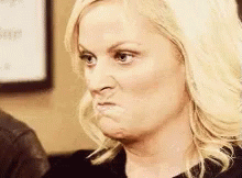 A Woman Is Making A Funny Face And Making A Funny Face With Her Mouth Open . GIF