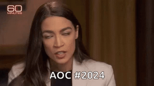 A Woman Is Making A Funny Face And Saying Aoc # 2024 While Sitting In A Chair . GIF
