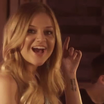 A Woman Is Making A Funny Face And Saying `` I Like That '' While Giving A Thumbs Up . GIF