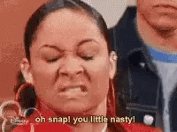 A Woman Is Making A Funny Face And Saying `` Oh Snap You Little Nasty '' . GIF