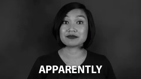 A Woman Is Making A Funny Face In A Black And White Photo While Holding A Sign That Says Apparently . GIF