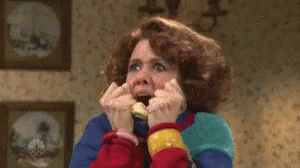 A Woman Is Making A Funny Face While Talking On A Phone . GIF